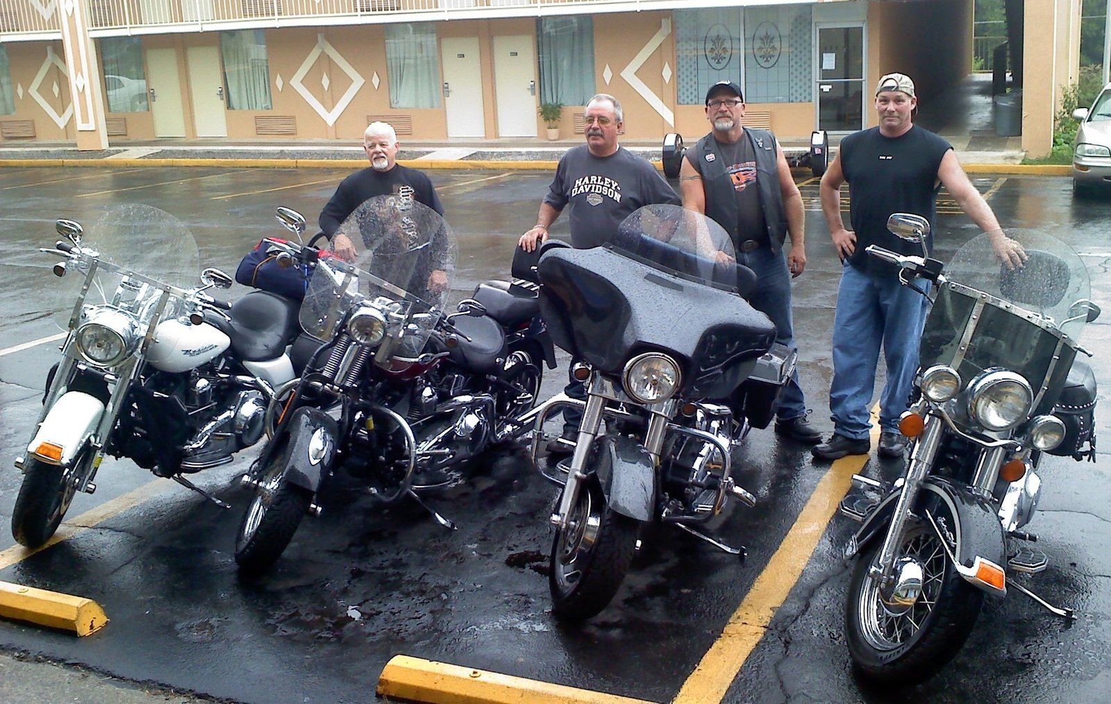 Four bikers and their Harleys lined up at a biker blessing in Gatlinburg, Tennessee