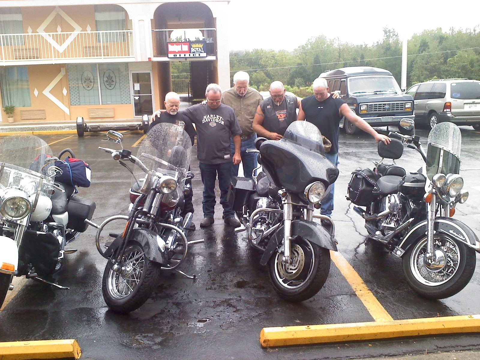 Bikers gathered in prayer with their motorcycles at a biker blessing in Gatlinburg, Tennessee
