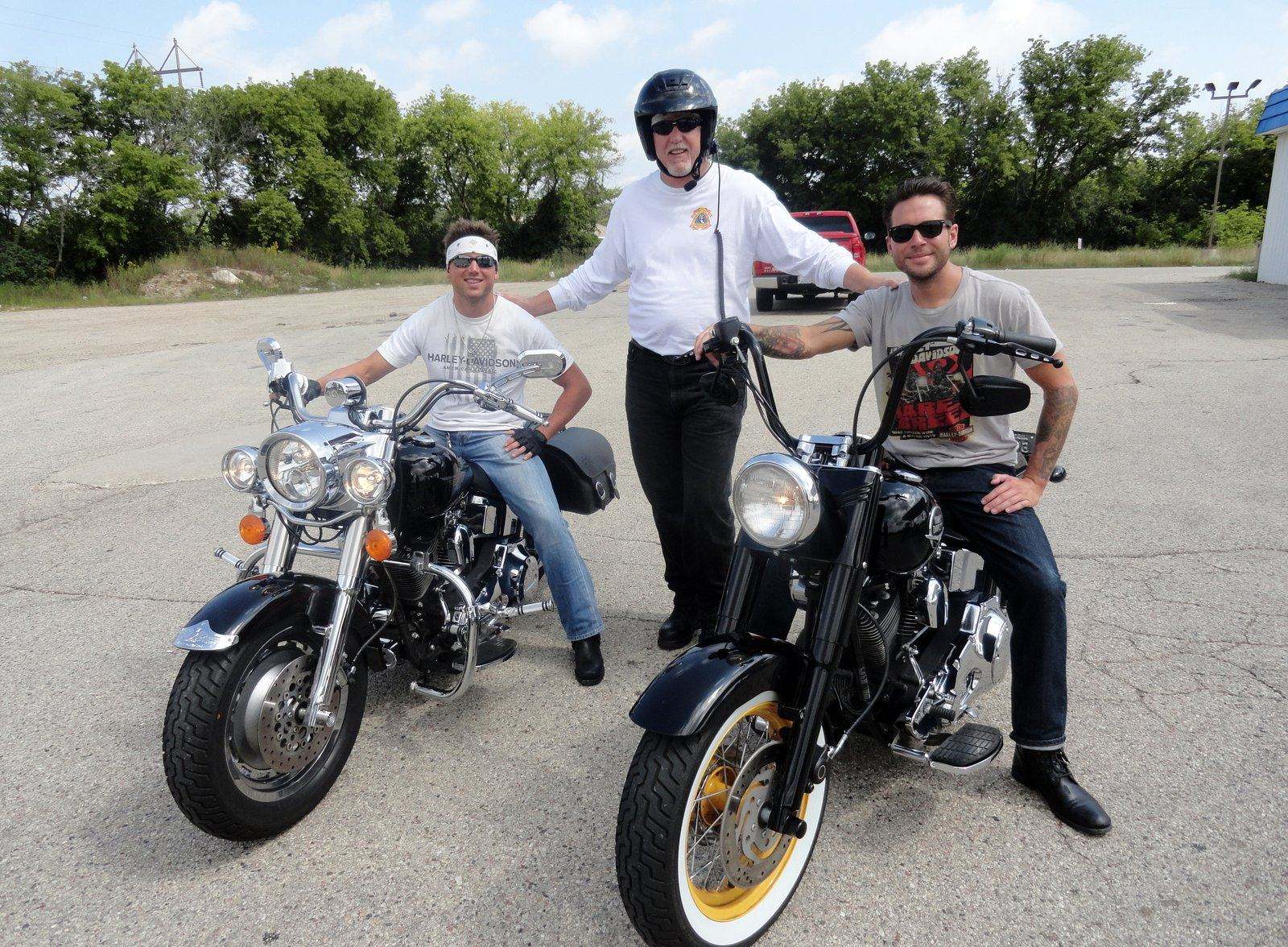 Tom Hughes with two riders and their custom Harleys at the Milwaukee 110th HOG anniversary