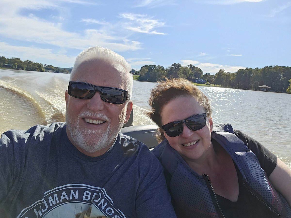 Tom and Cathy Hughes on a boat