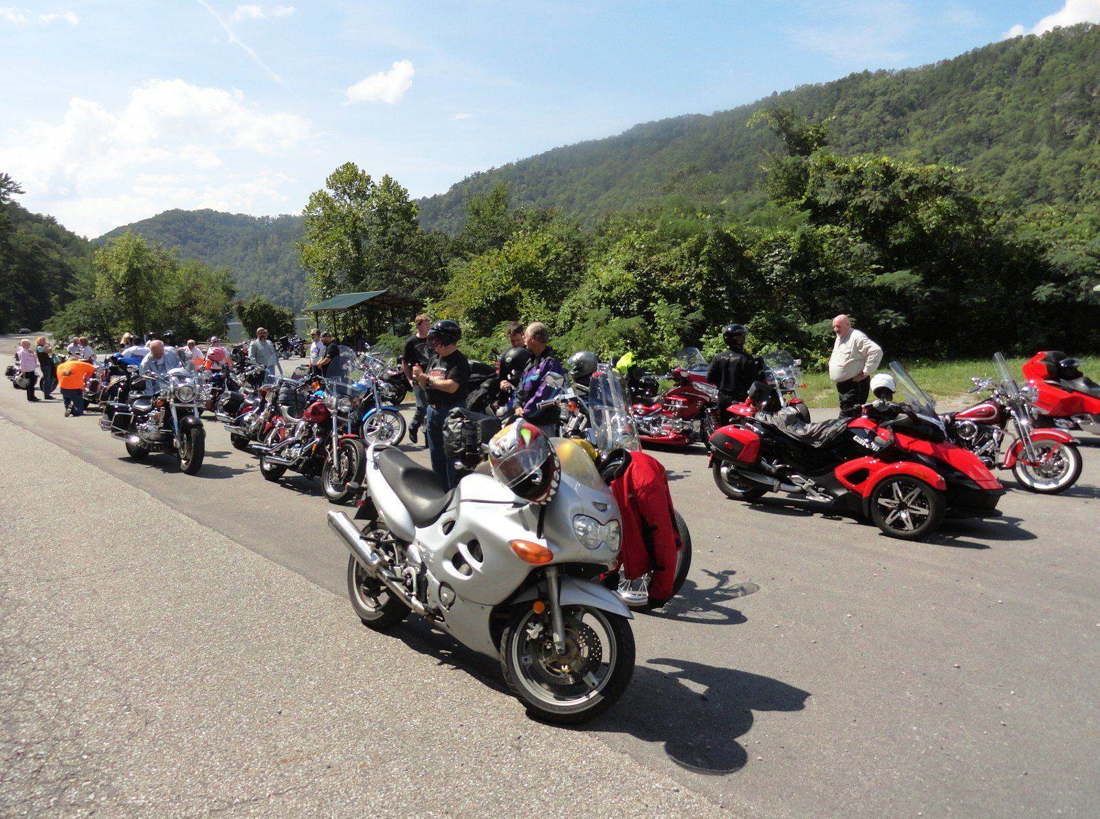 A lineup of touring motorcycles at a scenic pull-off during the SDA Rider Retreat