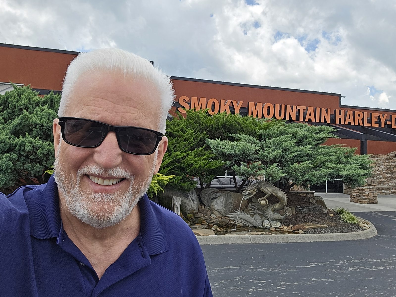 Tom Hughes in sunglasses outside Smoky Mountain Harley-Davidson