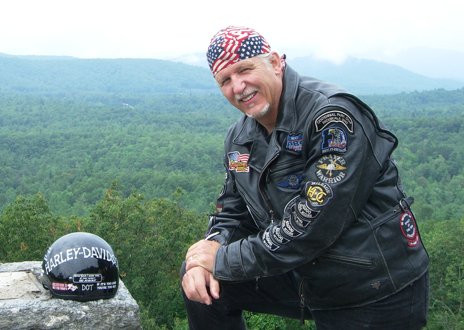 Pastor Tom Hughes in his leather jacket and flag bandana on a Blue Ridge overlook