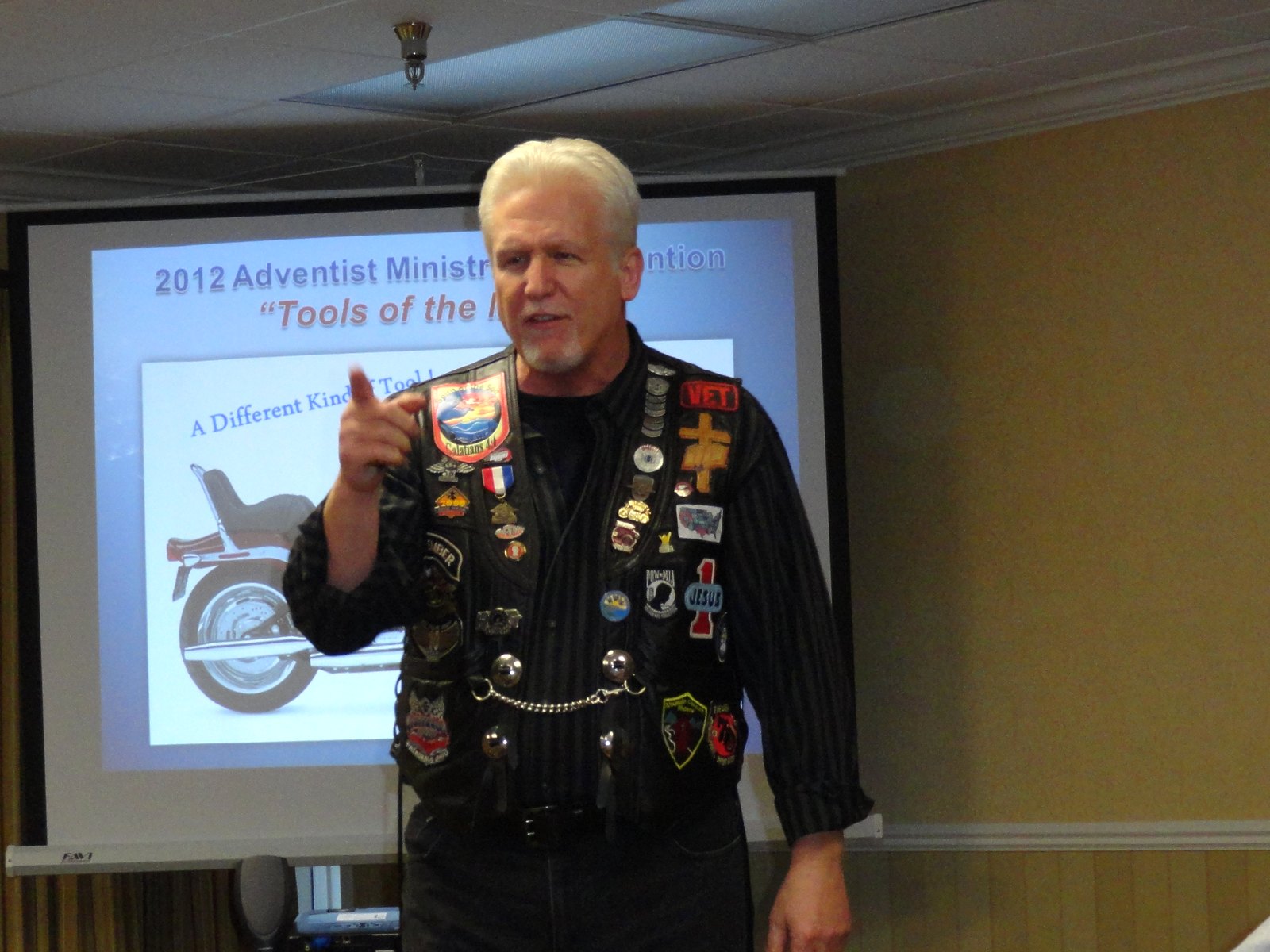 Pastor Tom Hughes preaching in his patched leather vest at the 2012 Adventist Ministers Convention